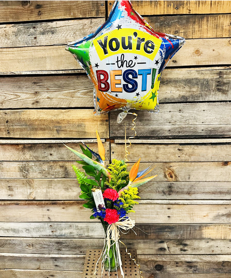 bright tropical bud vase filled with flowers