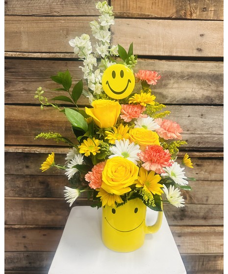 Be Happy with Roses - Yellow roses, white and yellow daisies fill a bright smiley face yellow mug. 
