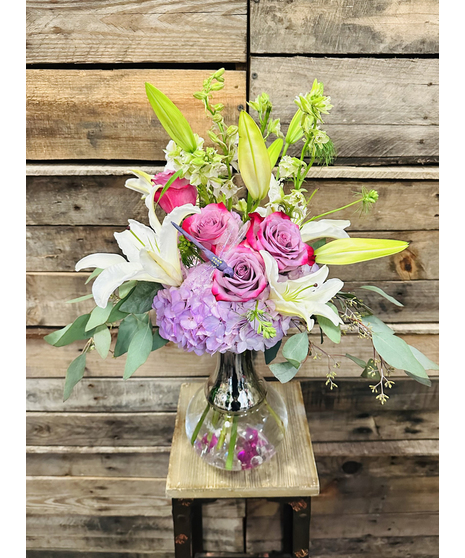 lavender roses accented with lilies and hydrangeas