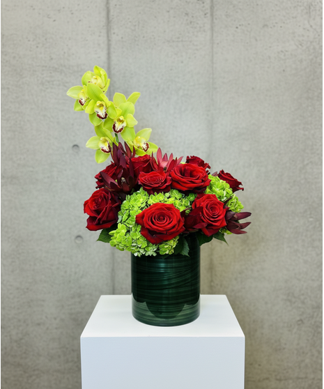 red roses and green hydrangeas accented with safari sunset