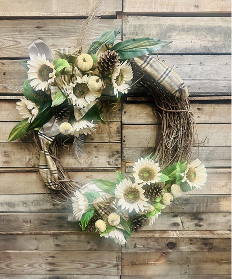 fall wreath with leaves, pumpkin, ribbon, and flower accents