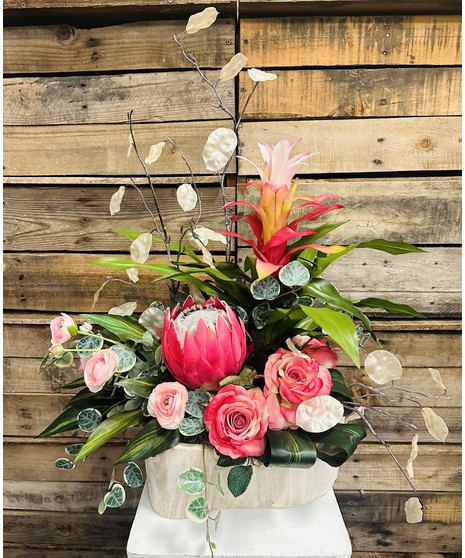 pink tropical arrangement featuring dramatic pink flowers