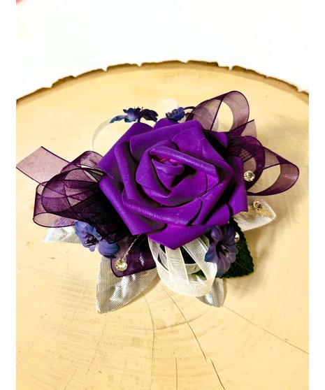 purple corsage with silk rose