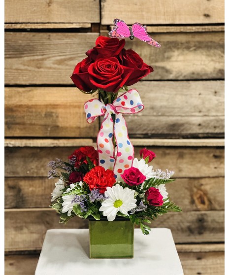 pink flowers in peacock pot