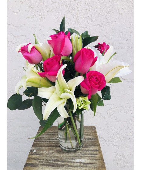 Modern Roses  & Lilies Roses, lilies, greenery in a tall glass cube 