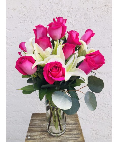 Modern Roses  & Lilies Roses, lilies, greenery in a tall glass cube 