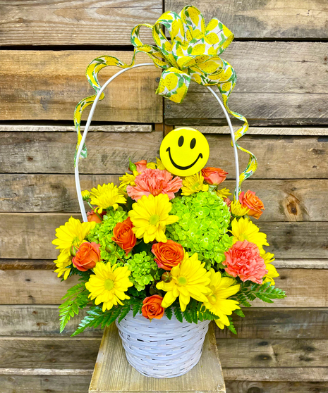 orange and green flowers in a basket