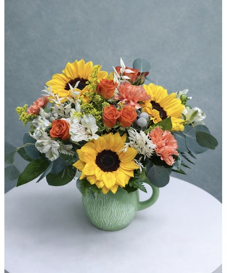 Vibrant sunflowers, white alstromeria, silver dollar eucalyptus, silver brunia, white dried ruscus and solidago