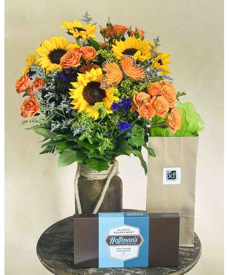 sunflowers and statice with butterfly accents