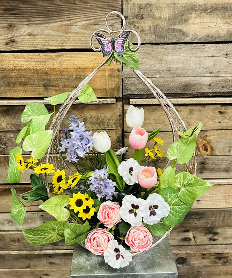silk flowers in spring themed wire basket
