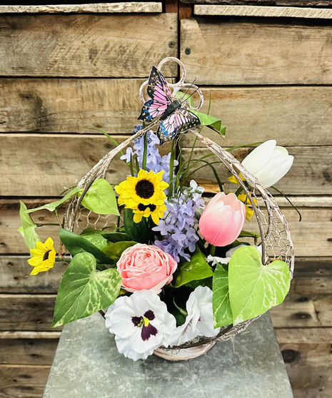 silk flowers in spring themed wire basket