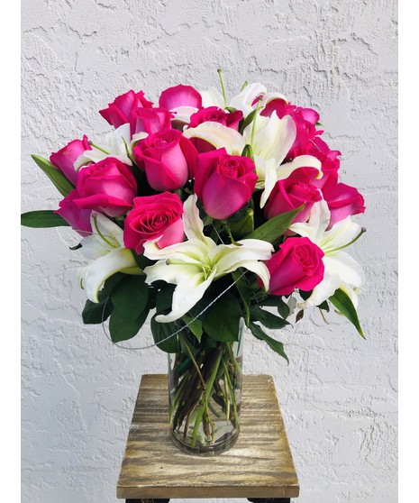 Modern Roses  & Lilies Roses, lilies, greenery in a tall glass cube 
