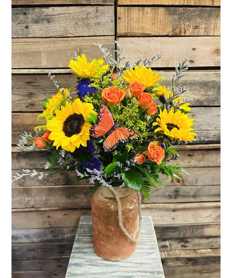 sunflowers and statice with butterfly accents